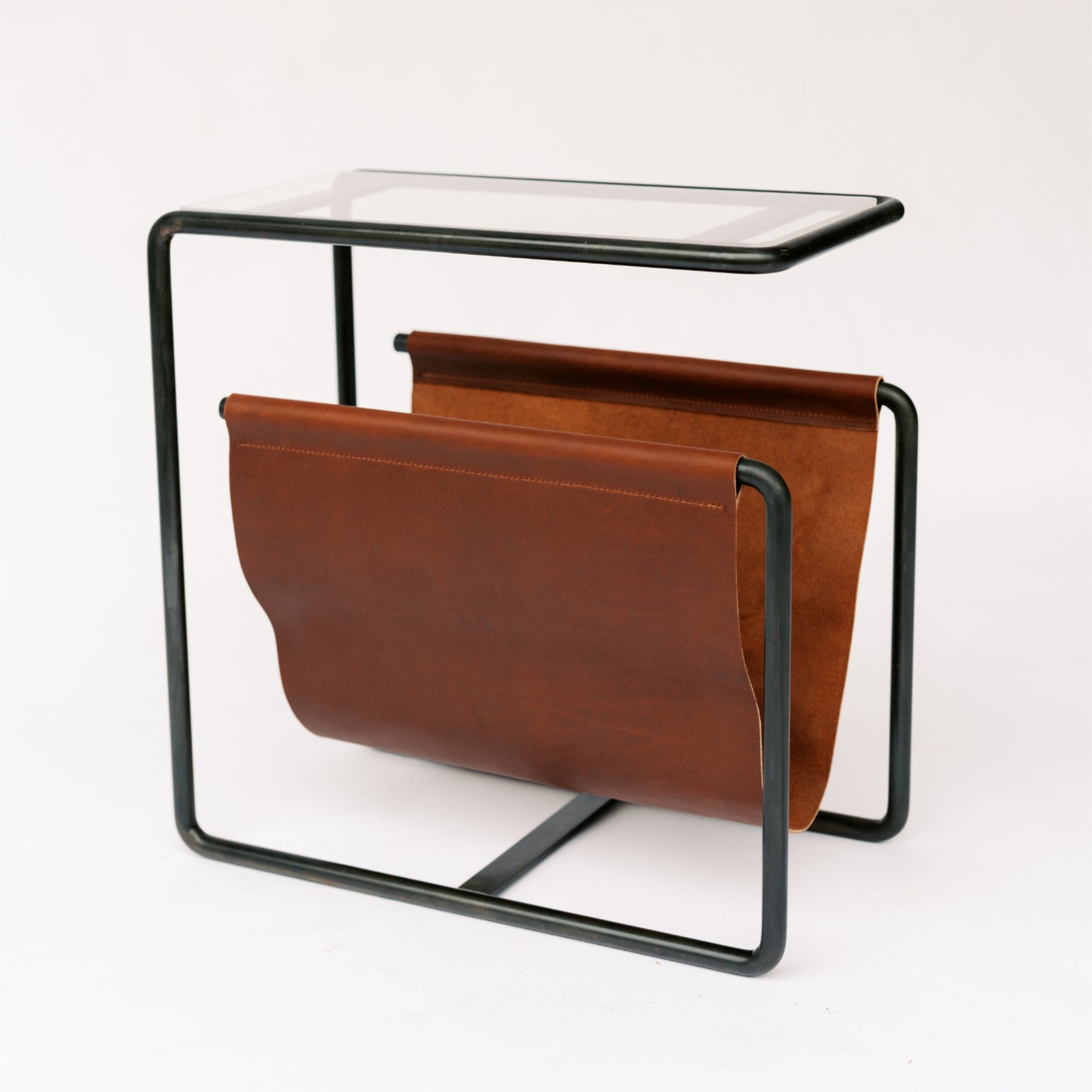 Black Oxide dark  steel and reddish brown full-grain leather magazine rack side table with tempered glass top